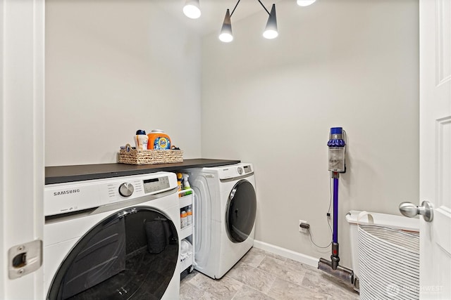 16712 8th Ave E, Spanaway, WA 98387 - laundry area with separate washer and dryer and baseboards
