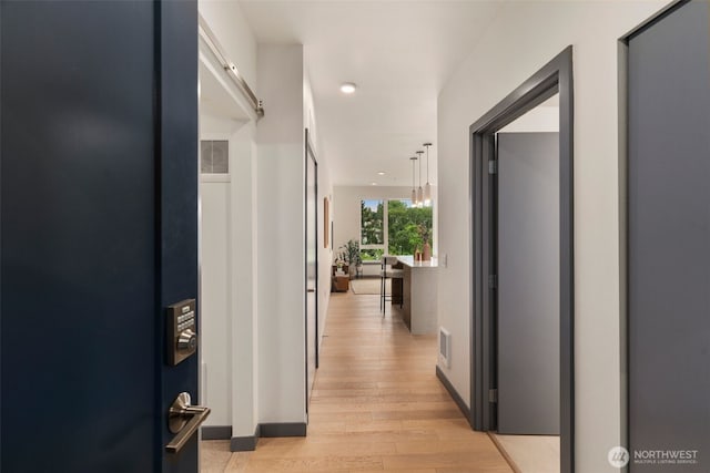 11903 NE 128th St Unit 612, Kirkland, WA 98034 - hall featuring light wood-type flooring and recessed lighting