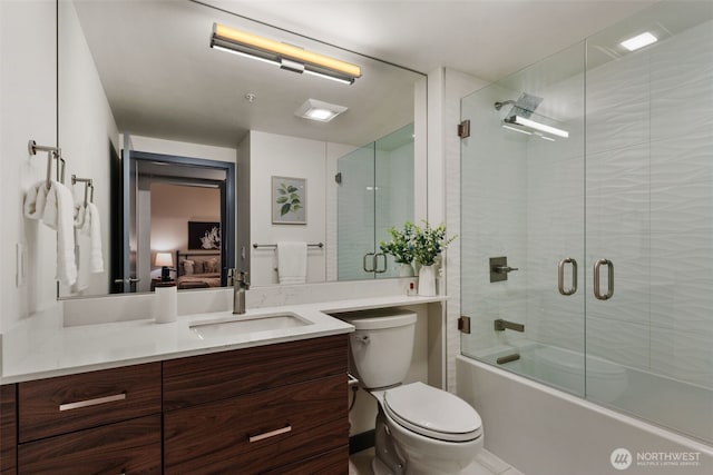 11903 NE 128th St Unit 612, Kirkland, WA 98034 - bathroom featuring vanity, shower / bath combination with glass door, and ensuite bath