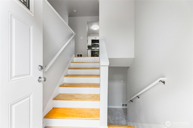 60 E Olyview Pl, Grapeview, WA 98546 - stairway featuring baseboards