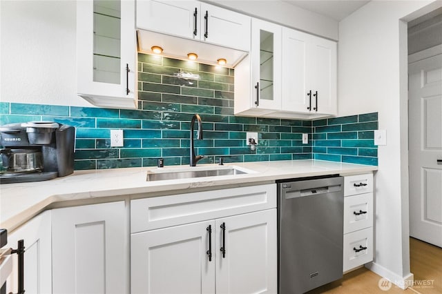 60 E Olyview Pl, Grapeview, WA 98546 - kitchen with dishwasher, white cabinets, decorative backsplash, and glass insert cabinets