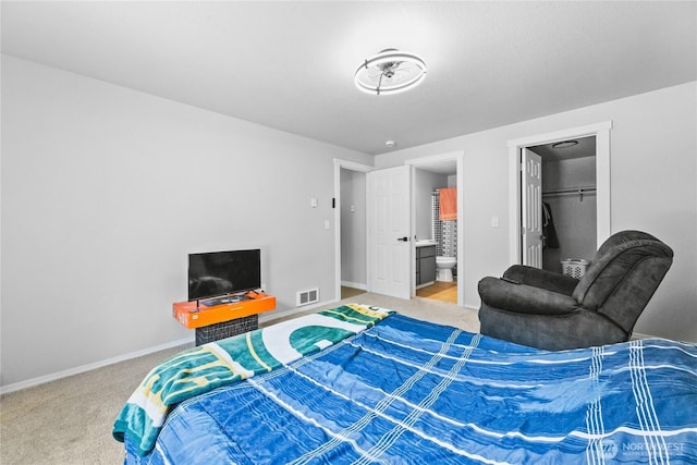 60 E Olyview Pl, Grapeview, WA 98546 - carpeted bedroom with baseboards and ensuite bathroom