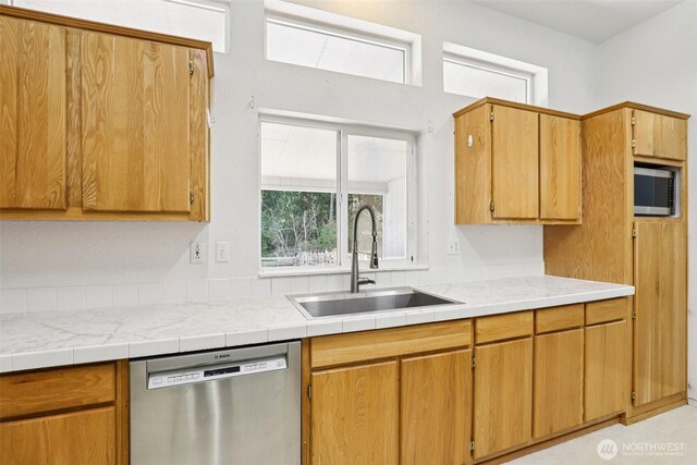 801 Hemlock Rd, Carson, WA 98610 - kitchen with stainless steel appliances, light countertops, and brown cabinetry