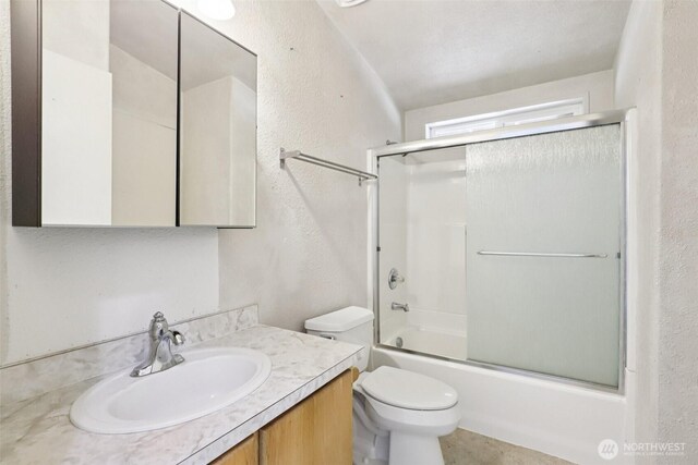 801 Hemlock Rd, Carson, WA 98610 - bathroom featuring a textured wall, vanity, and combined bath / shower with glass door