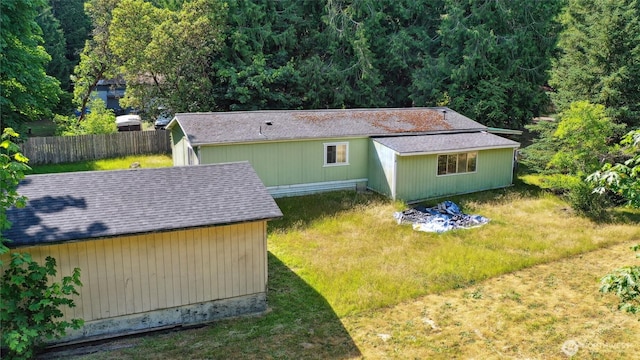 6321 41st Ave NW, Olympia, WA 98502 - rear view of property featuring a shingled roof and an outdoor structure
