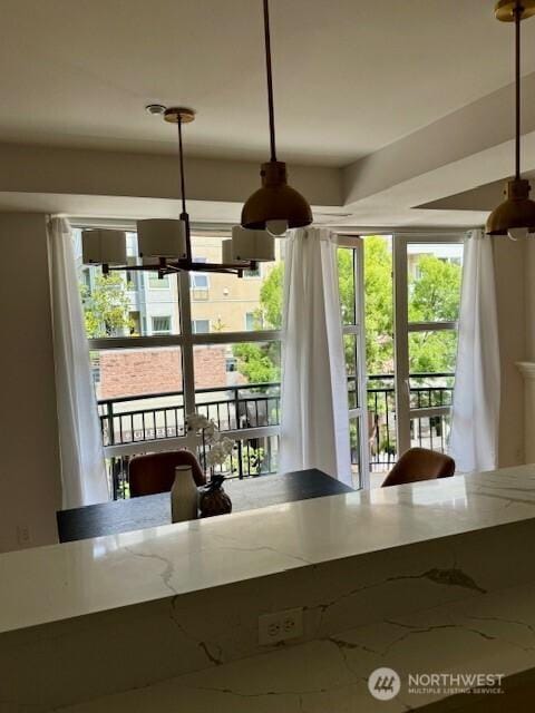 10047 Main St Unit 319, Bellevue, WA 98004 - dining area with a chandelier