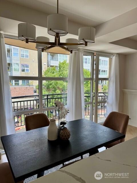 10047 Main St Unit 319, Bellevue, WA 98004 - dining area with a wainscoted wall