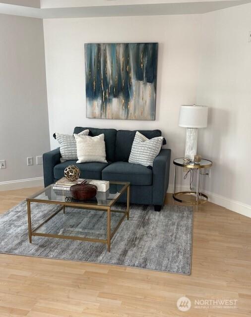10047 Main St Unit 319, Bellevue, WA 98004 - living area with baseboards and wood finished floors