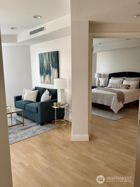 10047 Main St Unit 319, Bellevue, WA 98004 - bedroom featuring wood finished floors and baseboards