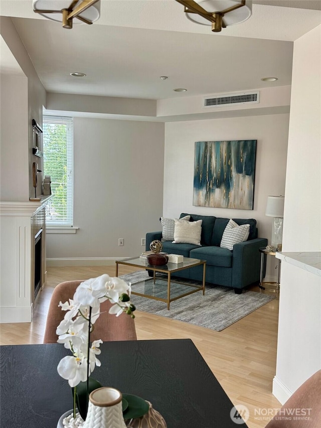 10047 Main St Unit 319, Bellevue, WA 98004 - living area featuring light wood-type flooring and recessed lighting