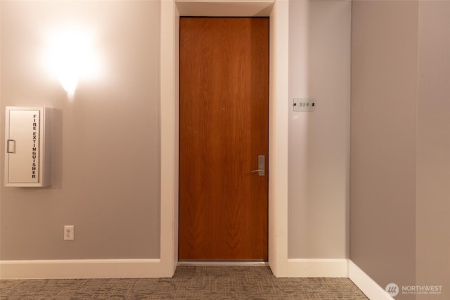 10047 Main St Unit 319, Bellevue, WA 98004 - hall featuring carpet and baseboards