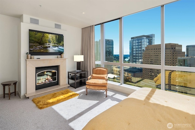 10650 NE 9th Pl Unit 2524, Bellevue, WA 98004 - carpeted living area with a view of city and a glass covered fireplace