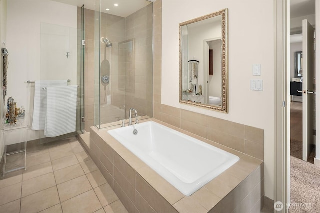 10650 NE 9th Pl Unit 2524, Bellevue, WA 98004 - bathroom featuring a garden tub, a shower stall, and tile patterned flooring