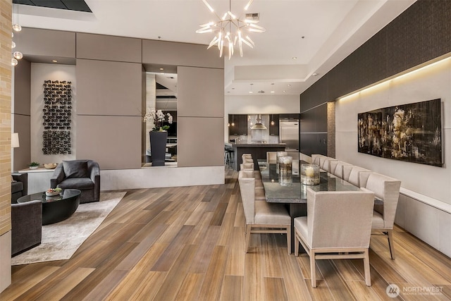 10650 NE 9th Pl Unit 2524, Bellevue, WA 98004 - dining space featuring a chandelier and light wood-style flooring