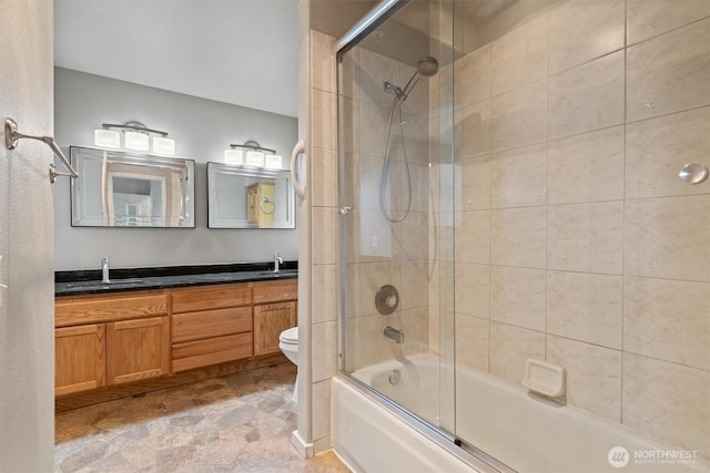 2420 Grand Ave Unit 103, Everett, WA 98201 - full bathroom featuring combined bath / shower with glass door, double vanity, and stone finish floors