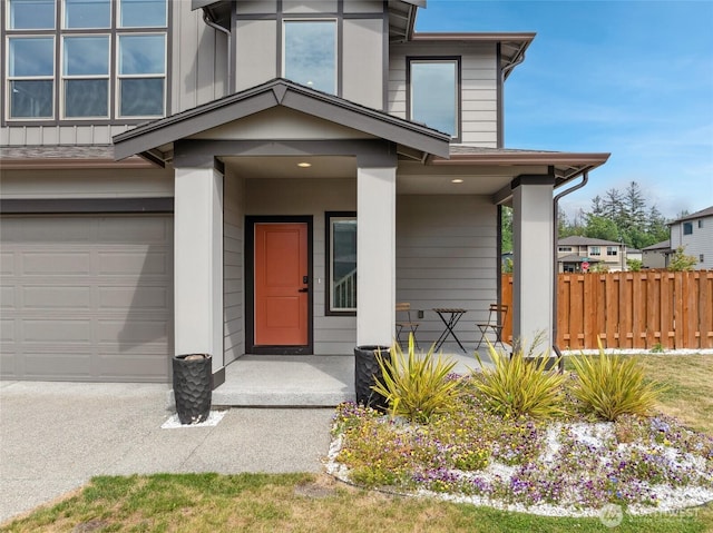 298 Hovey St, Buckley, WA 98321 - doorway to property with a garage, covered porch, and board and batten siding