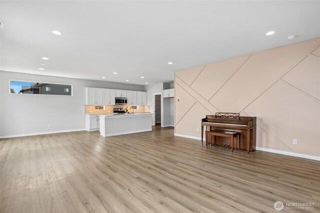298 Hovey St, Buckley, WA 98321 - living area featuring light wood finished floors and recessed lighting