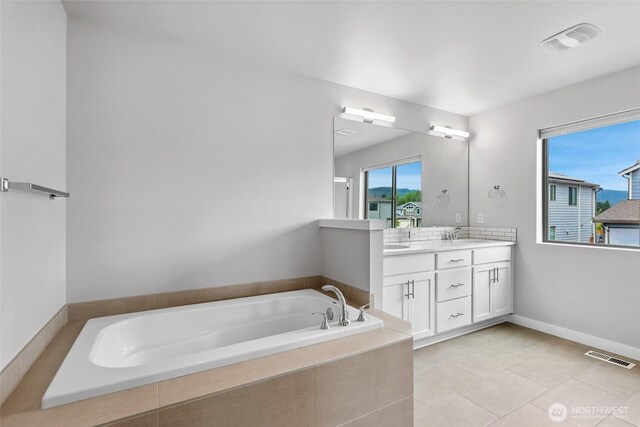 298 Hovey St, Buckley, WA 98321 - full bathroom featuring double vanity, a bath, and tile patterned floors
