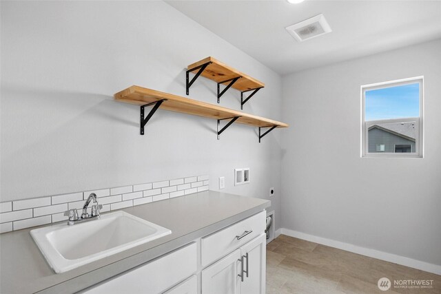 298 Hovey St, Buckley, WA 98321 - laundry room featuring washer hookup, cabinet space, and electric dryer hookup