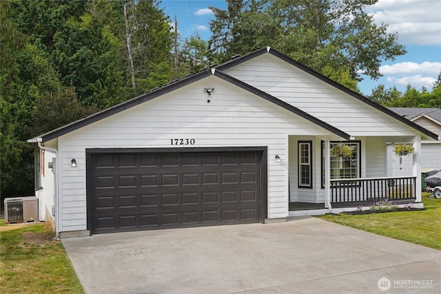 17230 Heather Ln SE, Yelm, WA 98597 - ranch-style house with covered porch and a garage