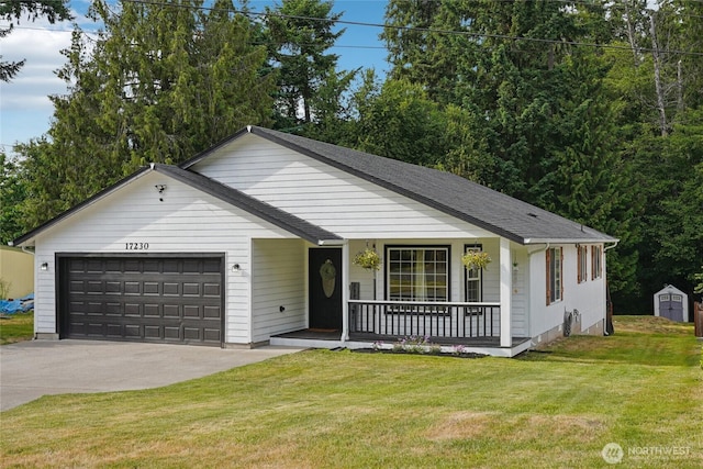 17230 Heather Ln SE, Yelm, WA 98597 - ranch-style house with covered porch, a garage, a front yard, driveway, and a storage shed