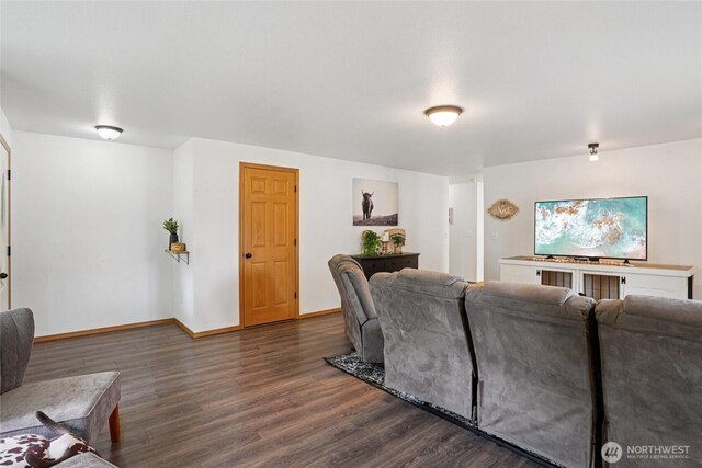 17230 Heather Ln SE, Yelm, WA 98597 - living room featuring dark wood-style flooring and baseboards