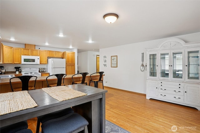 17230 Heather Ln SE, Yelm, WA 98597 - dining room with light wood-style flooring and recessed lighting