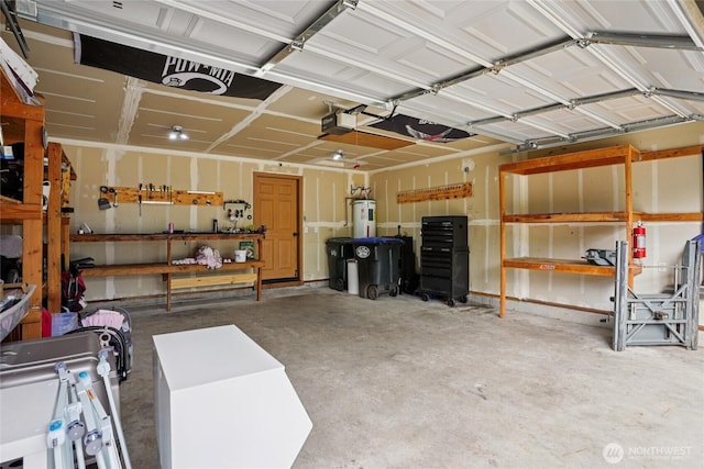 17230 Heather Ln SE, Yelm, WA 98597 - garage featuring water heater and a garage door opener