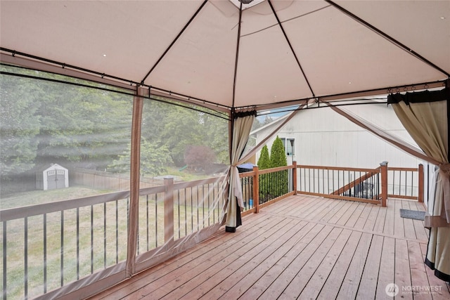 17230 Heather Ln SE, Yelm, WA 98597 - wooden deck with a gazebo, a storage shed, and a lawn