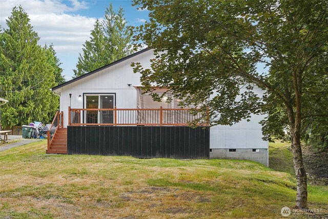 17230 Heather Ln SE, Yelm, WA 98597 - view of home's exterior featuring a yard and a wooden deck