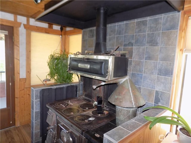 361 Rehmke Rd, Tonasket, WA 98855 - detailed view of a wood stove, wood finished floors, and tile counters