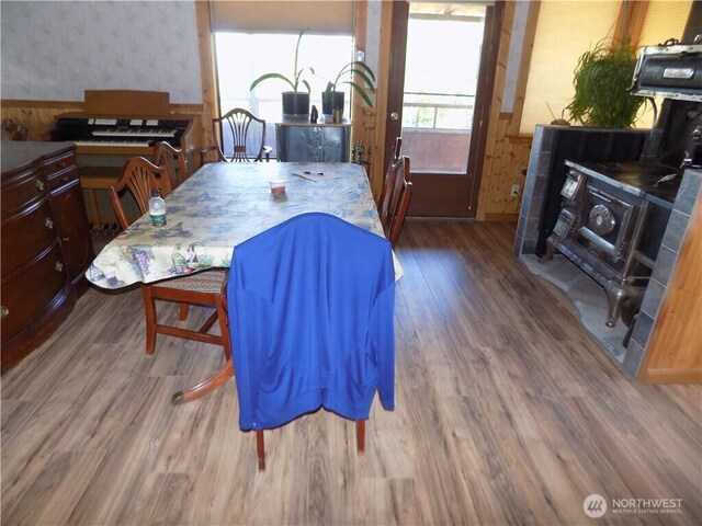 361 Rehmke Rd, Tonasket, WA 98855 - dining space featuring wallpapered walls, wainscoting, and wood finished floors