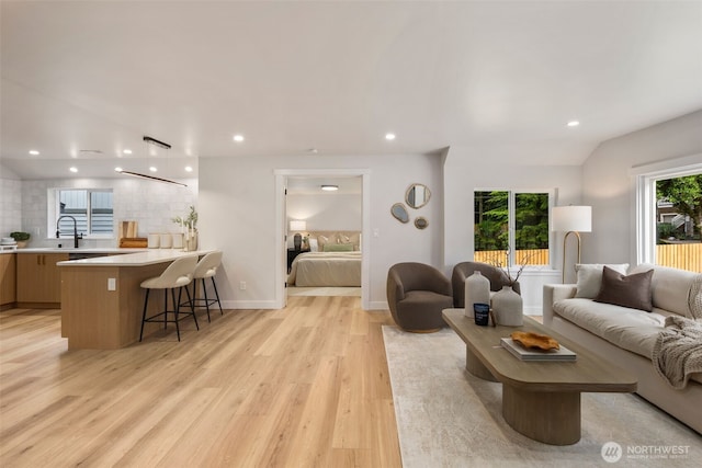 840 NE 100th St Unit A, Seattle, WA 98125 - living area featuring light wood-style flooring and recessed lighting
