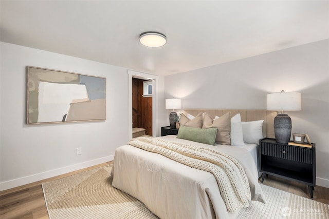 840 NE 100th St Unit A, Seattle, WA 98125 - bedroom with baseboards and wood finished floors