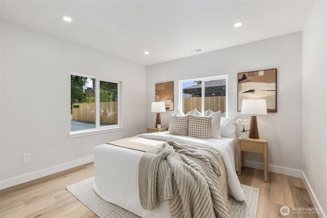 840 NE 100th St Unit A, Seattle, WA 98125 - bedroom with light wood-style flooring and recessed lighting