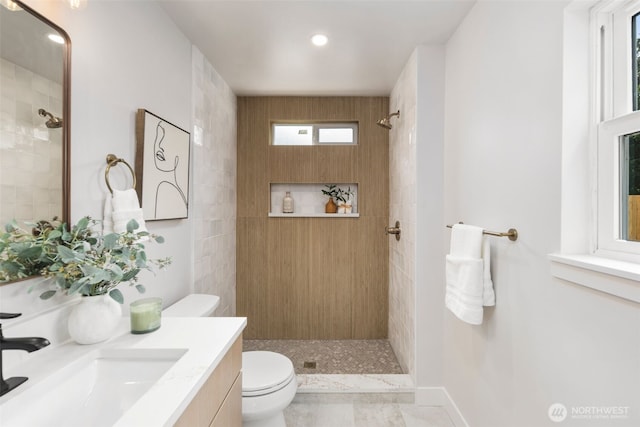 840 NE 100th St Unit A, Seattle, WA 98125 - bathroom with a tile shower, vanity, and recessed lighting