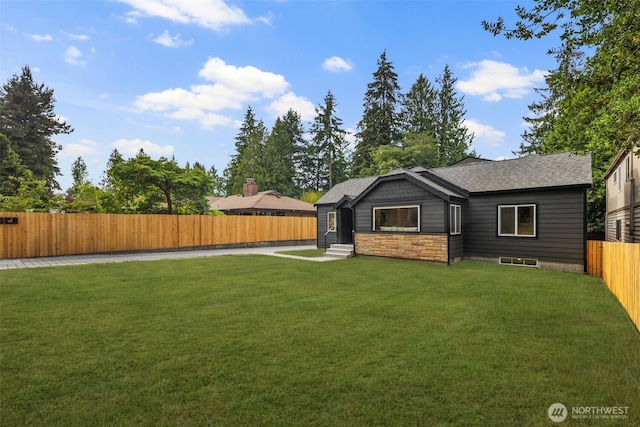 840 NE 100th St Unit A, Seattle, WA 98125 - rear view of house with entry steps, a fenced backyard, and a shingled roof
