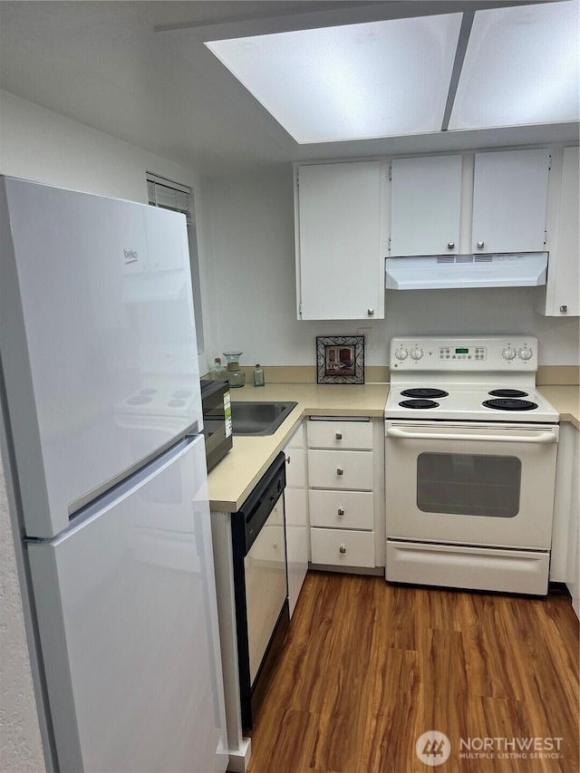 4800 200th St SW Unit E205, Lynnwood, WA 98036 - kitchen with white appliances, light countertops, dark wood-style floors, under cabinet range hood, and white cabinetry