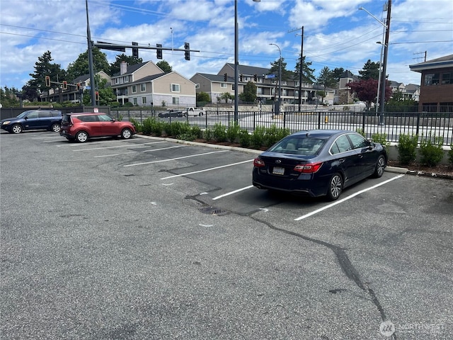 4800 200th St SW Unit E205, Lynnwood, WA 98036 - uncovered parking lot with a residential view