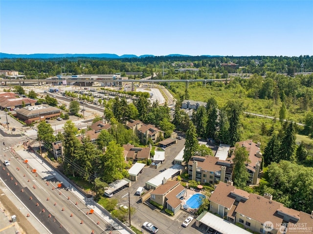 4800 200th St SW Unit E205, Lynnwood, WA 98036 - drone / aerial view of a mountain backdrop and a highway