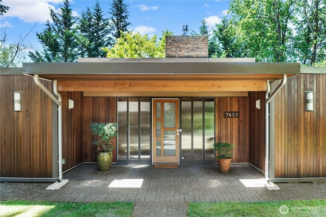 7623 NE 123rd St, Kirkland, WA 98034 - doorway to property with elevator and a chimney