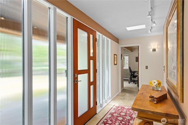 7623 NE 123rd St, Kirkland, WA 98034 - entryway with track lighting, a skylight, light tile patterned floors, and baseboard heating