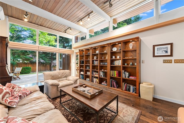 7623 NE 123rd St, Kirkland, WA 98034 - living area featuring rail lighting, a wood ceiling with exposed beams, wood finished floors, a towering ceiling, and an AC wall unit