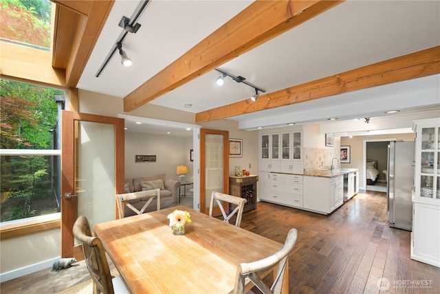 7623 NE 123rd St, Kirkland, WA 98034 - dining room with rail lighting, dark wood finished floors, and beamed ceiling