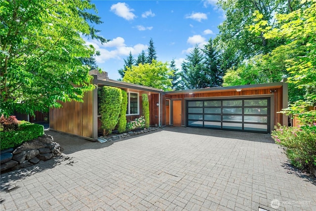 7623 NE 123rd St, Kirkland, WA 98034 - view of front facade featuring an attached garage and driveway