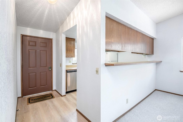 25036 110th Ave SE Unit 25A, Kent, WA 98030 - entryway featuring a textured ceiling and light wood-type flooring