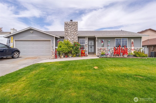 327 N Grape Dr, Moses Lake, WA 98837 - ranch-style home featuring stone siding, an attached garage, a front yard, and driveway