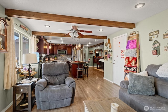 327 N Grape Dr, Moses Lake, WA 98837 - living room with light wood finished floors, beam ceiling, a ceiling fan, and recessed lighting