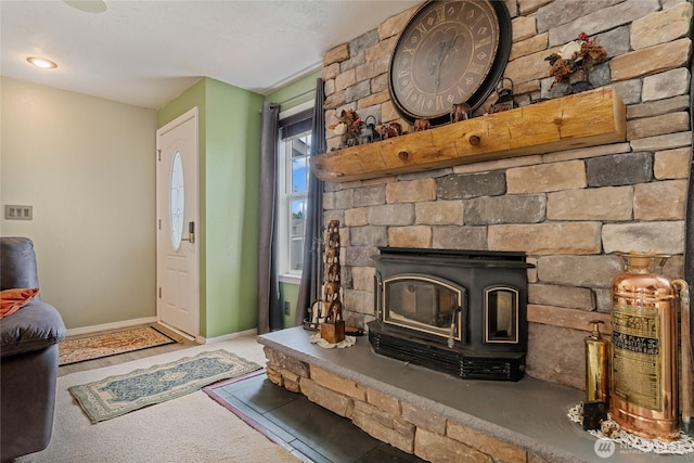 327 N Grape Dr, Moses Lake, WA 98837 - unfurnished living room featuring carpet and a wood stove