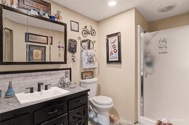 327 N Grape Dr, Moses Lake, WA 98837 - bathroom with tasteful backsplash, a shower stall, and vanity